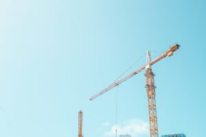 Orange construction crane at a building site - Netherlands development loans for larger schemes
